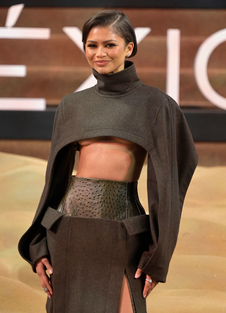 Zendaya in a high-neck crop top and skirt at an event