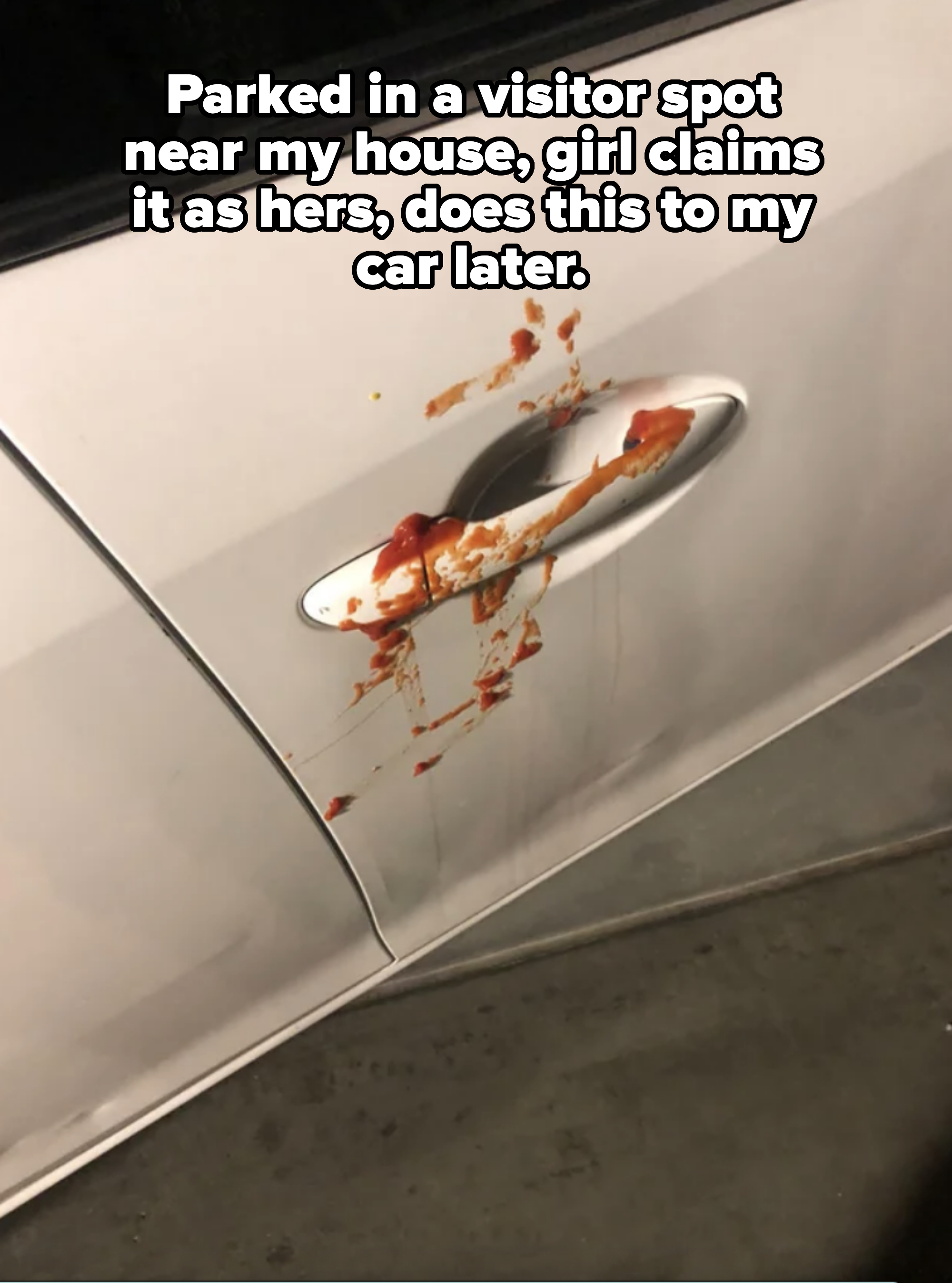 tomato sauce smeared on a car door after someone parked in a visitor spot