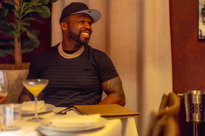 50 cent at a restaurant table