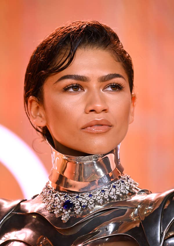 Zendaya wearing a metallic outfit with an ornate collar necklace