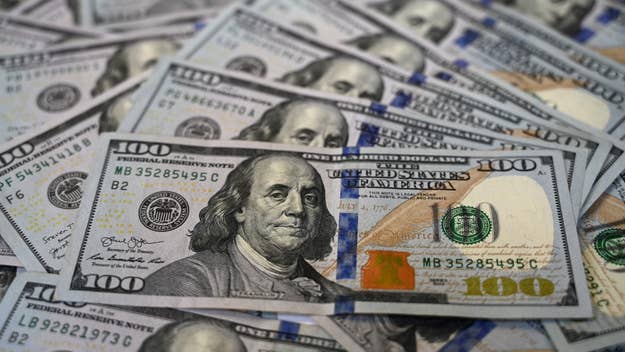 Scattered U.S. hundred-dollar bills