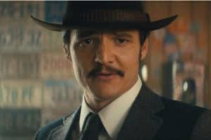 Pedro Pascal in a cowboy hat and suit.