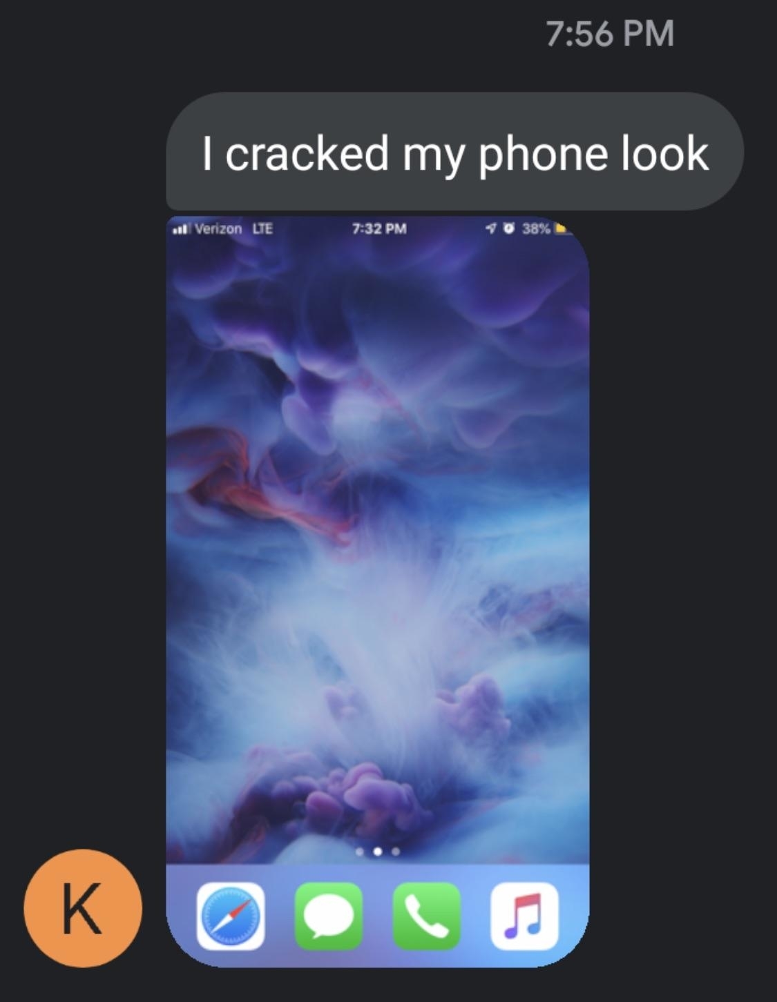 Screenshot of a smartphone&#x27;s home screen with visible icons and a celestial scene, with text message saying &quot;I cracked my phone look&quot;