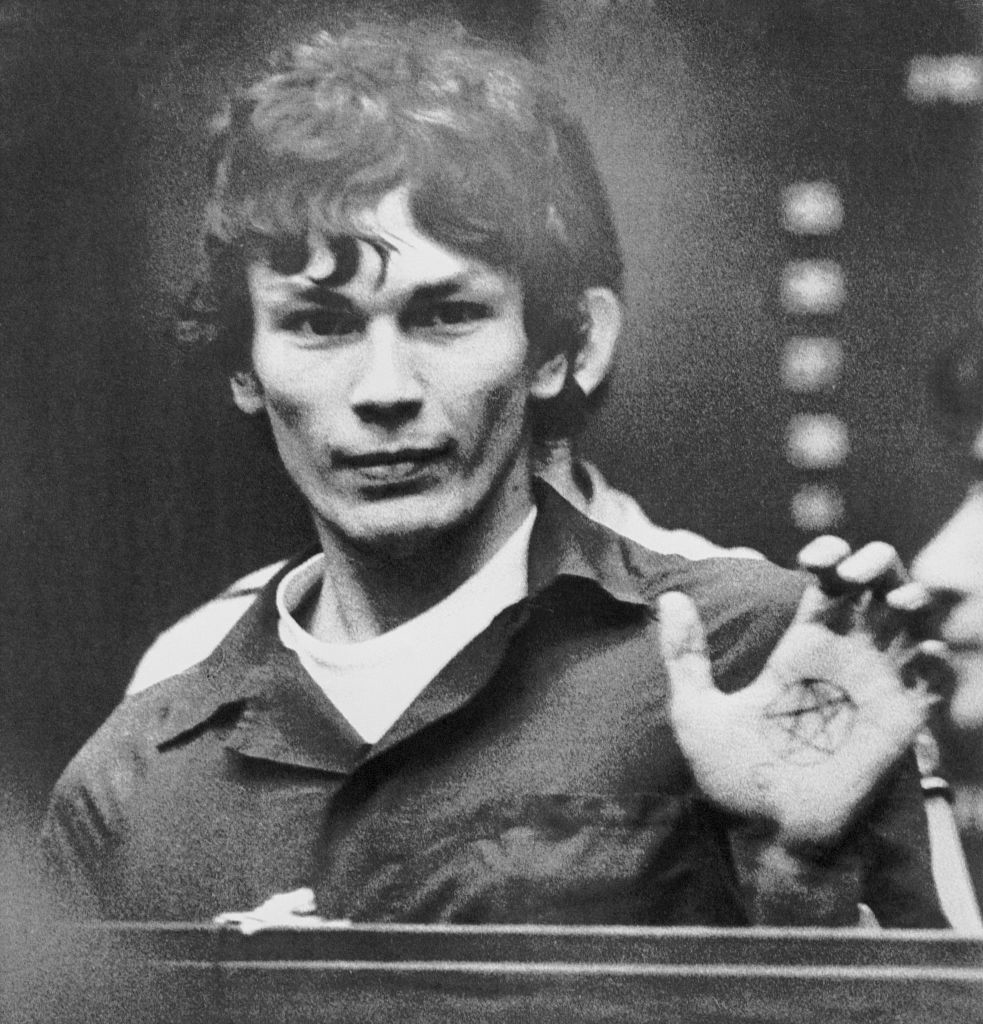 Richard Ramirez in court with a pentacle drawn on his hand
