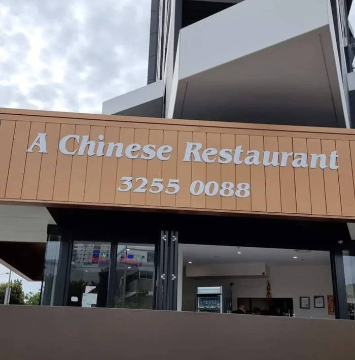 Signboard of a business named &#x27;A Chinese Restaurant&#x27; with a phone number listed below