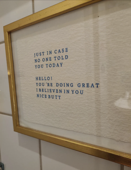 Framed wall art with uplifting phrases about self-worth and a humorous compliment