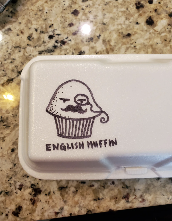 Styrofoam container with a drawing of a cupcake and "ENGLISH MUFFIN" text underneath