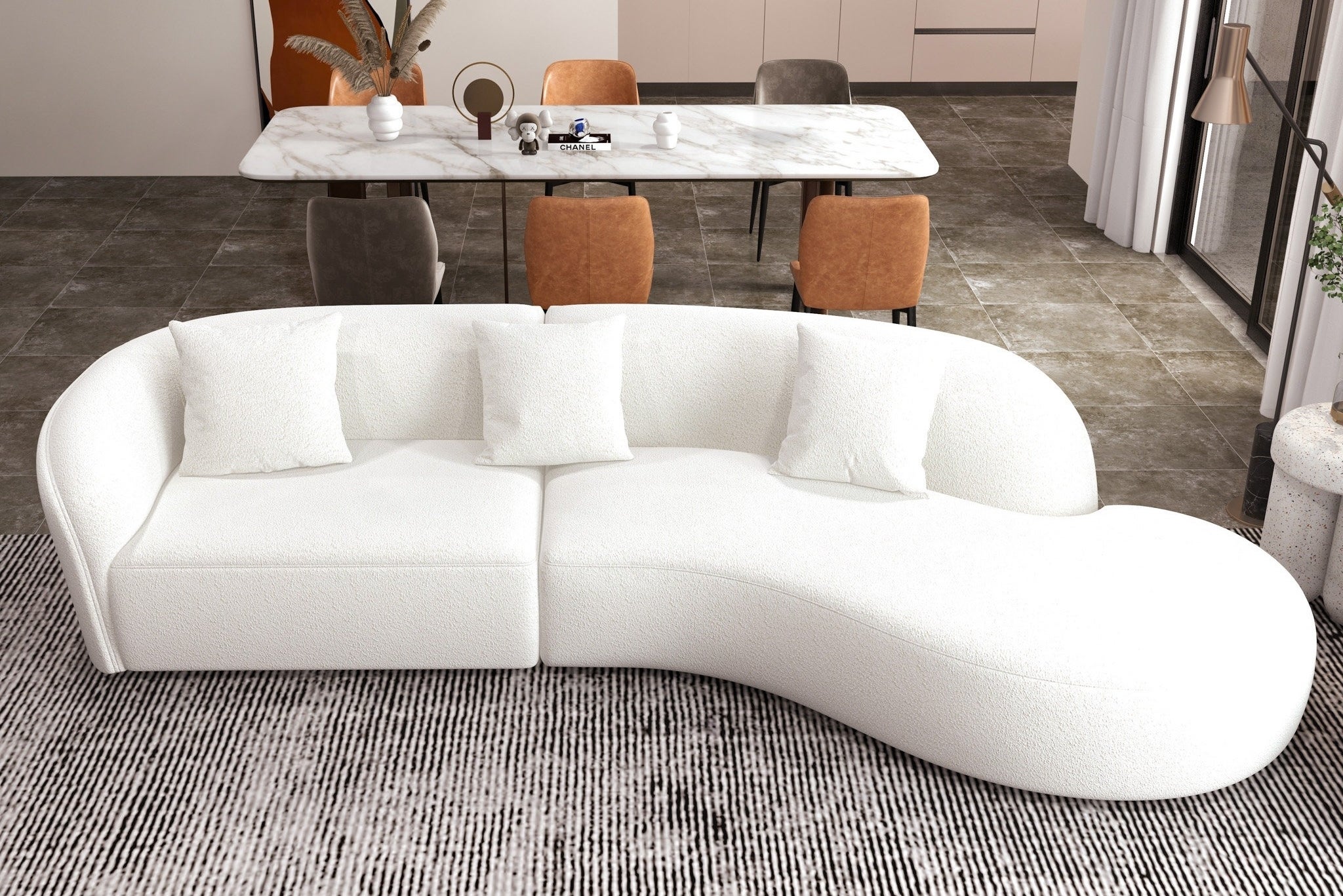 An irregularly shaped white sectional is shown