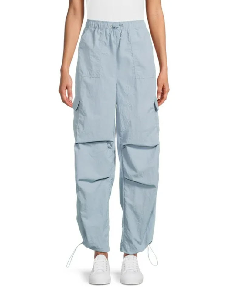 Light blue cargo pants with drawstrings, worn with white sneakers