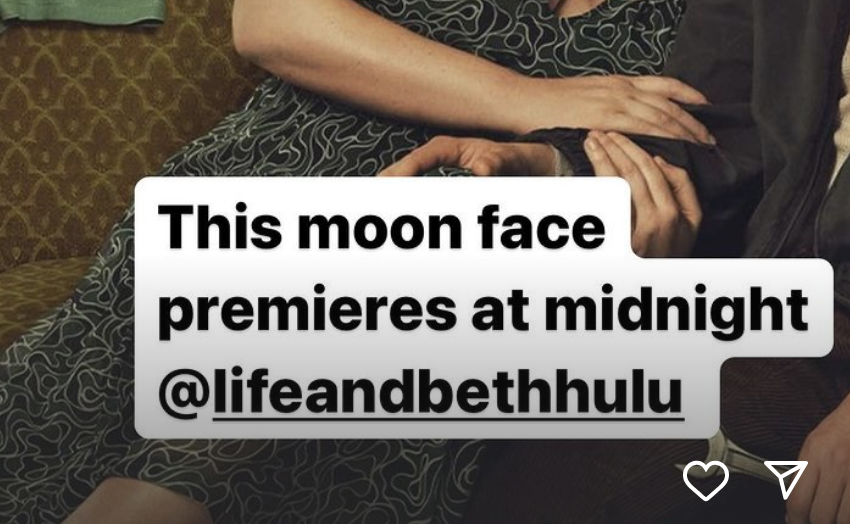 Image from her IG story with text &quot;This moon face premieres at midnight @lifeandbethhulu&quot; over a photo of Amy with another person sitting close on a couch