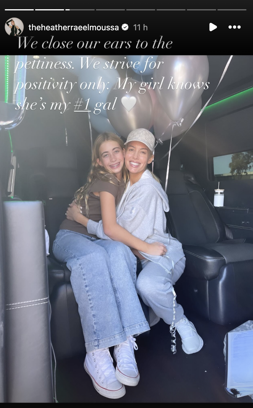 Heather and Taylor smiling and hugging, with Taylor sitting on Heather&#x27;s lap, surrounded by balloons inside a vehicle