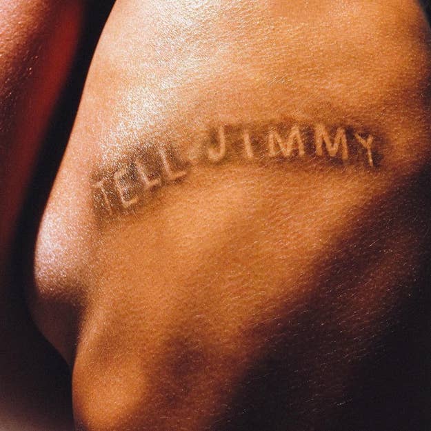 Close-up of a person's skin with the words "HELI JIMMY" imprinted on it, related to music