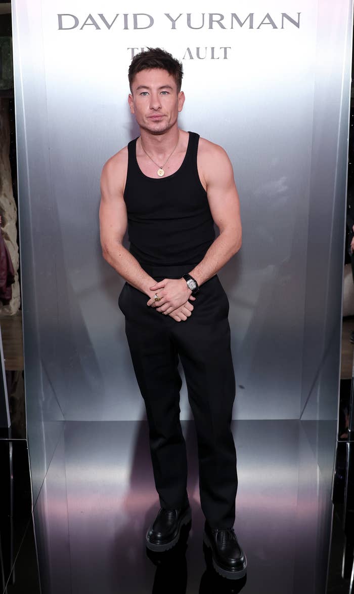 Barry in black sleeveless muscle shirt and pants at David Yurman event.