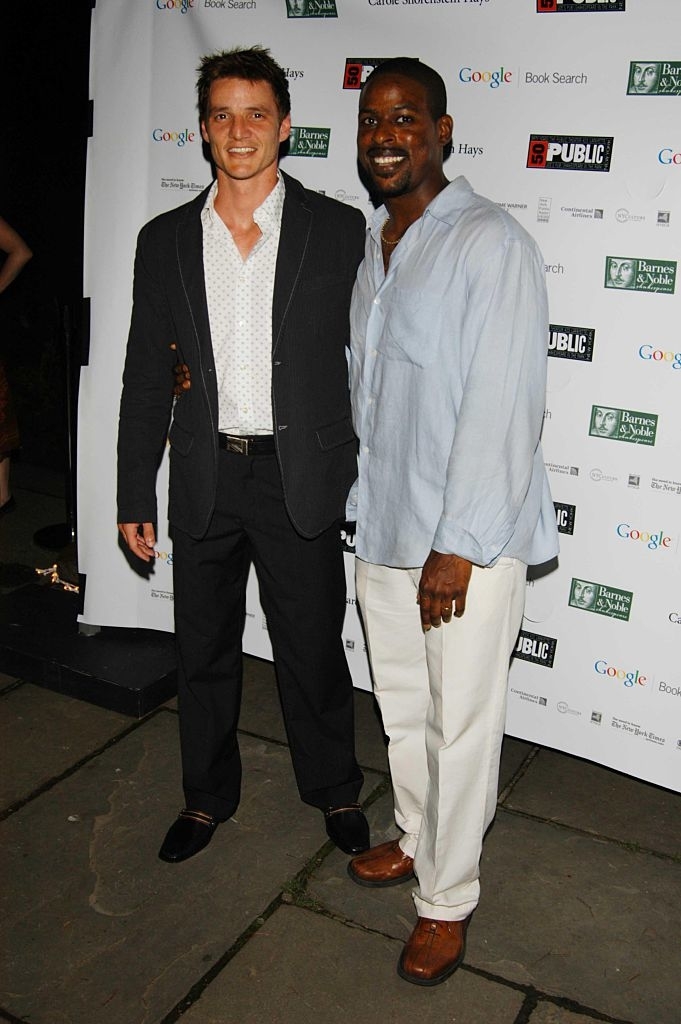 Pedro, in a blazer and shirt, with Sterling K Brown, in a linen shirt and pants, at an event, both smiling