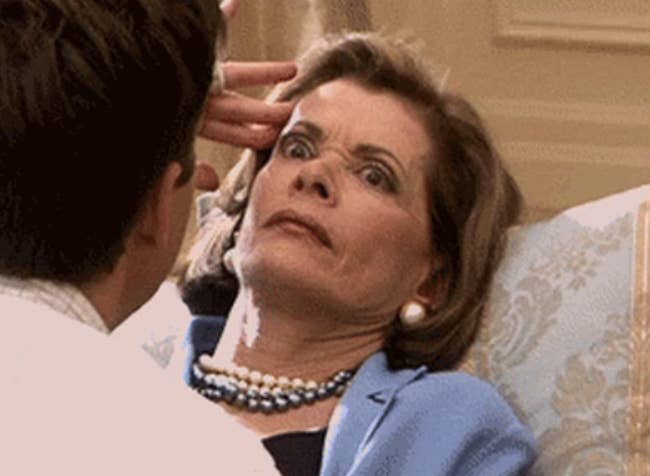 Jessica Walter on &quot;Arrested Development&quot; with her eyes opened wide while she lays down