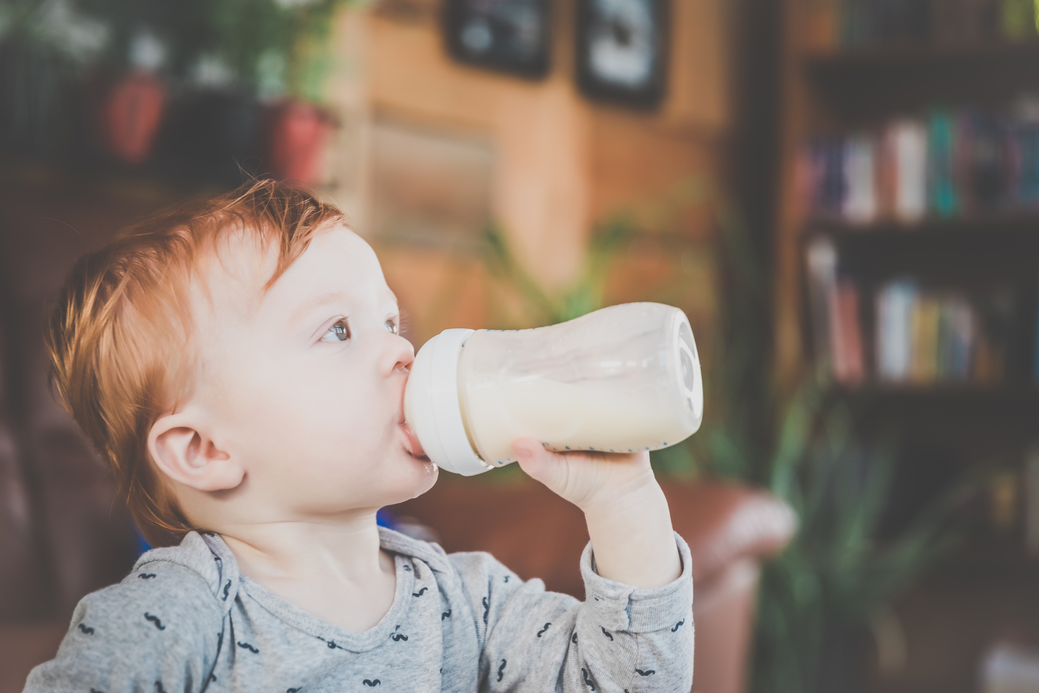 Toddler drinking from a bottle
