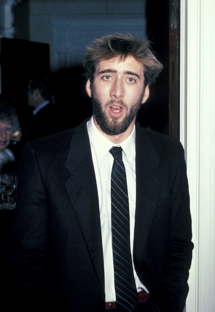 Nicolas with a beard and suit at an event