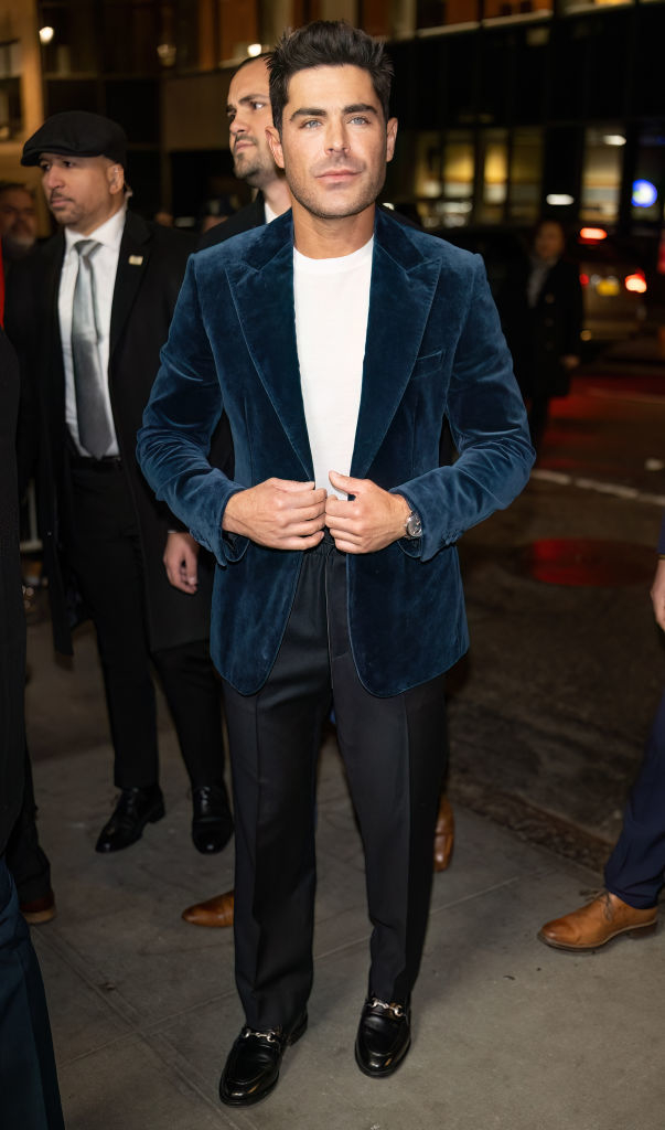Zac is in a velvet suit jacket