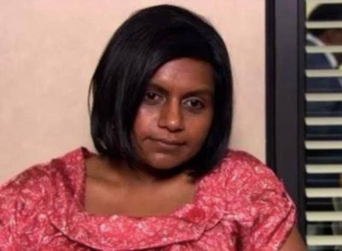 Mindy Kaling as character Kelly Kapoor looks away from the camera with an expression of defeat
