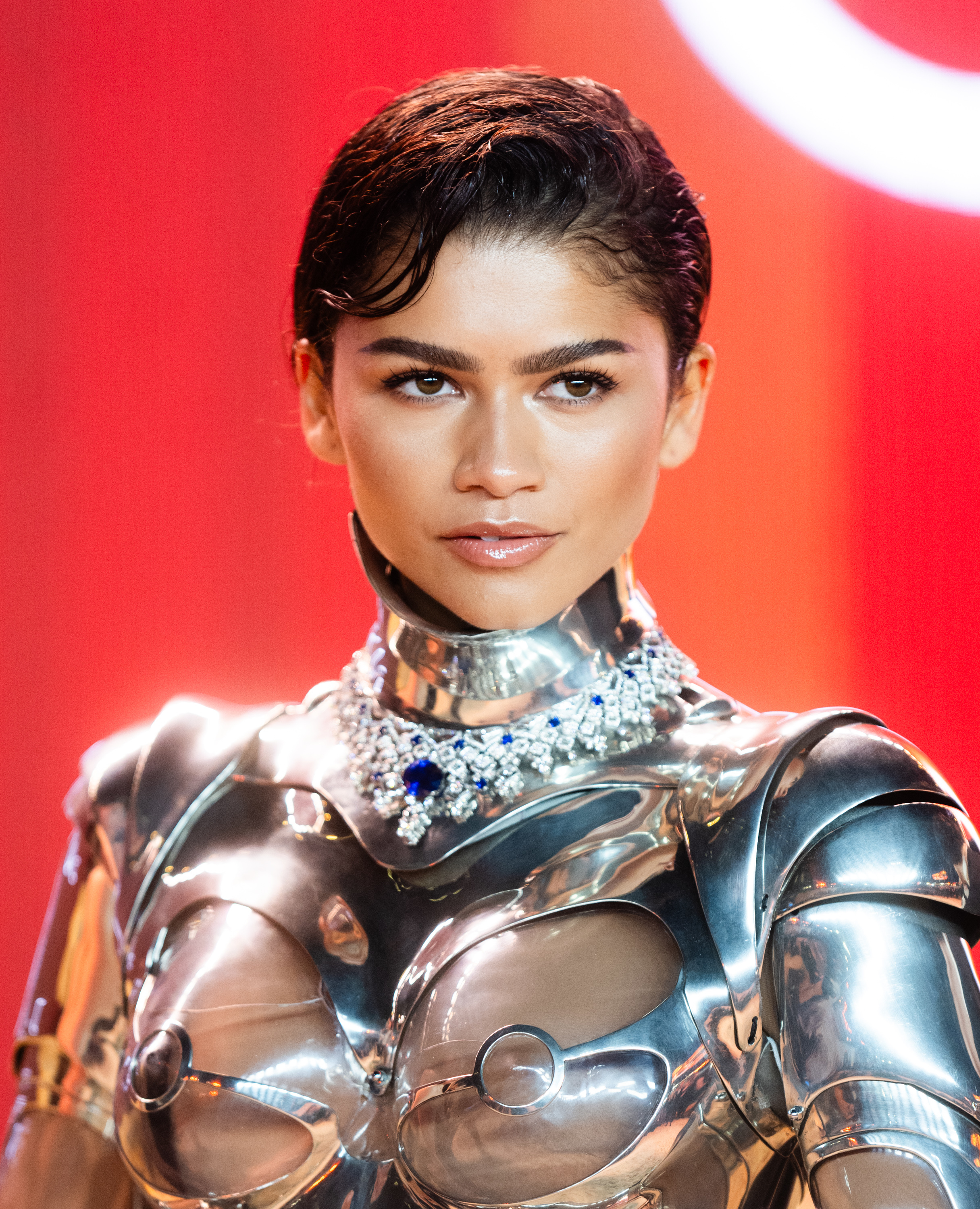 Zendaya in a metallic structured outfit with an embellished neckline