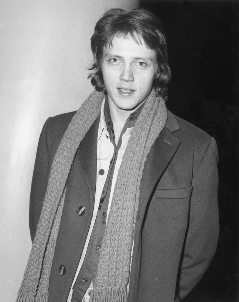 Christopher in a jacket and scarf, casual style