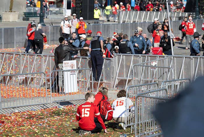 Person being attended to by emergency services at a crowded event