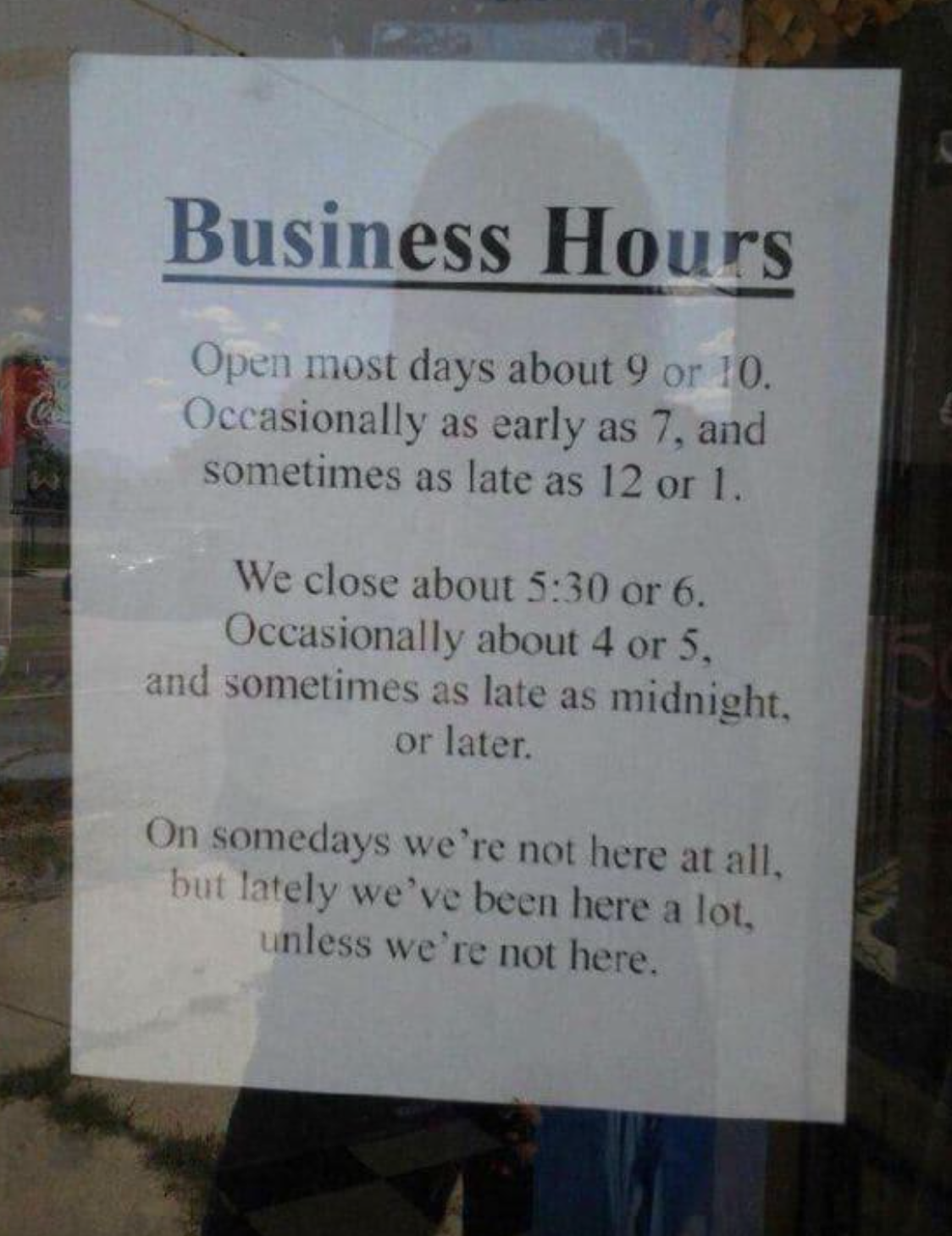Sign with humorous business hours, mentioning varied opening and closing times, admitting inconsistency