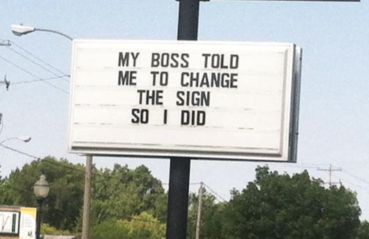 A roadside sign with the text &quot;MY BOSS TOLD ME TO CHANGE THE SIGN SO I DID.&quot;