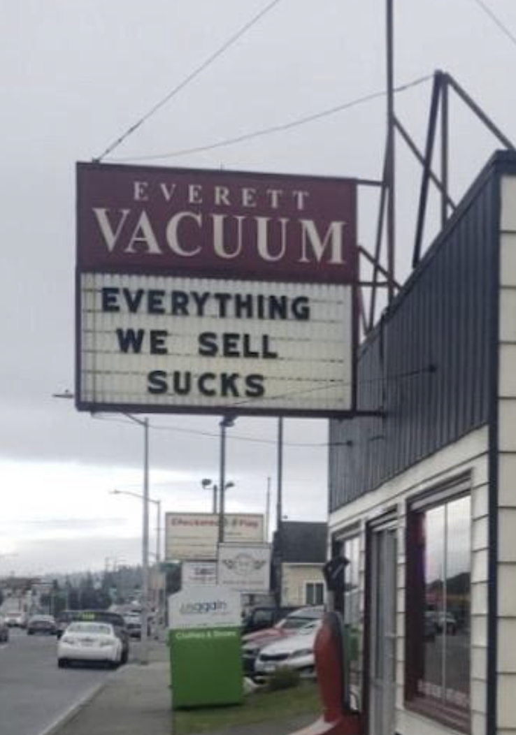 vacuum store sign reads &quot;EVERETT VACUUM EVERYTHING WE SELL SUCKS&quot;