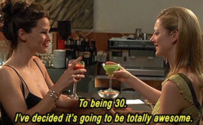 Two women are toasting with drinks, smiling, with text &quot;To being 30. I&#x27;ve decided it&#x27;s going to be totally awesome.&quot;