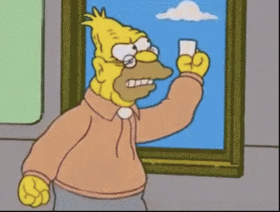 Grandpa Simpson from &#x27;The Simpsons&#x27; animated series is waving a piece of paper