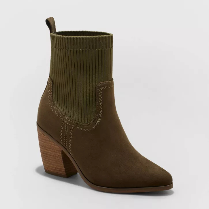 Olive green sock boot with brown pointed toe and stacked heel.