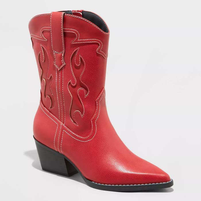 Red cowboy boot with traditional stitching, angled view showcasing design