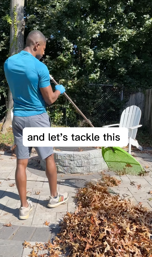 Kyshawn raking leaves with text overlay &quot;and let&#x27;s tackle this&quot; in a garden setting