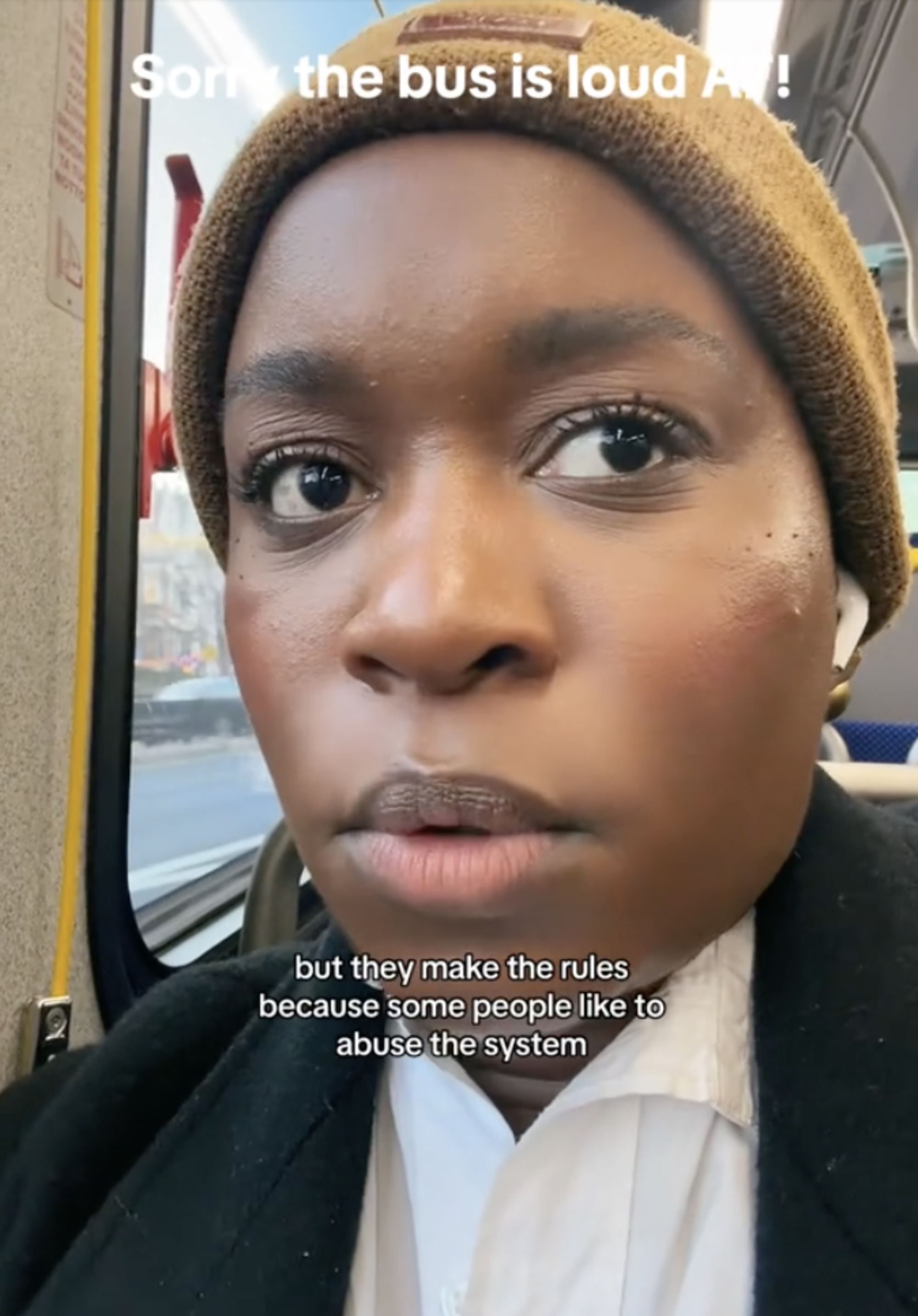 imani on bus wearing a hat, with text overlay: &quot;they make the rules because some people like to abuse the system&quot;