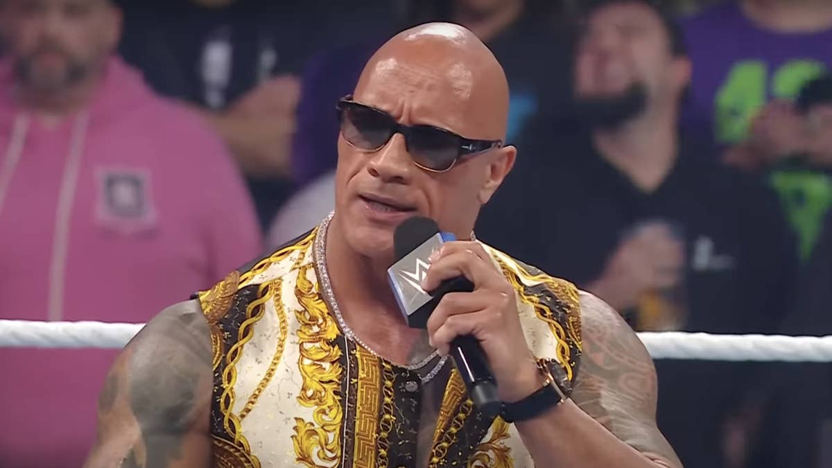 The WWE legend wore a Versace vest reminiscent of his 1997 corporate persona.
