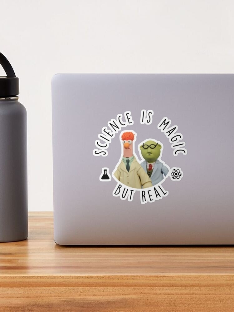 Laptop with a sticker of the Muppets&#x27; Beaker and Dr. Bunsen with text &quot;Science is magic but real.&quot;