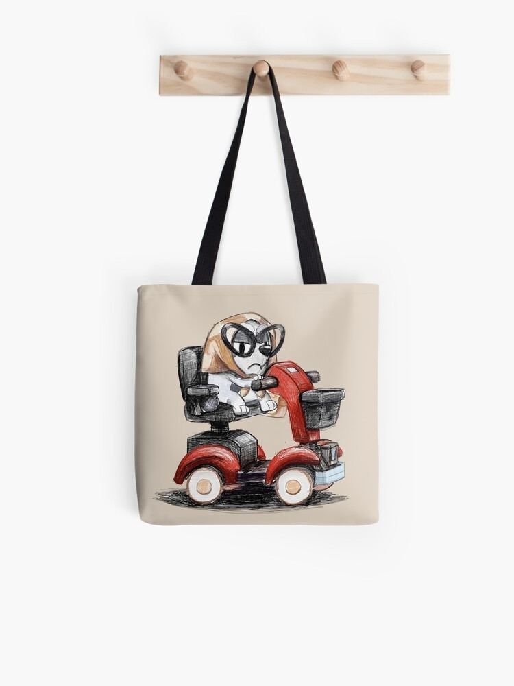Tote bag featuring an illustration of a dog riding a mobility scooter