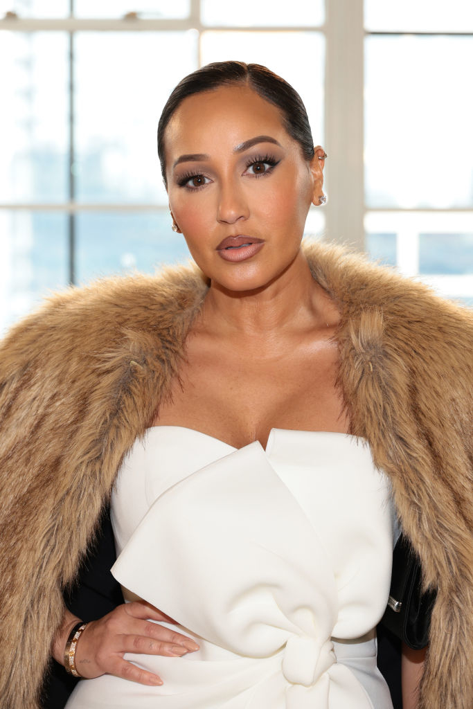 closeup of her in elegant outfit with fur coat