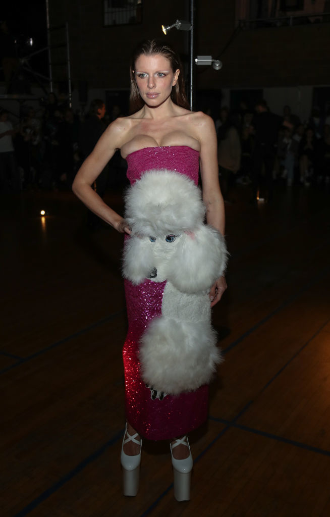 Julia in a unique dress with plush toy details standing at an event