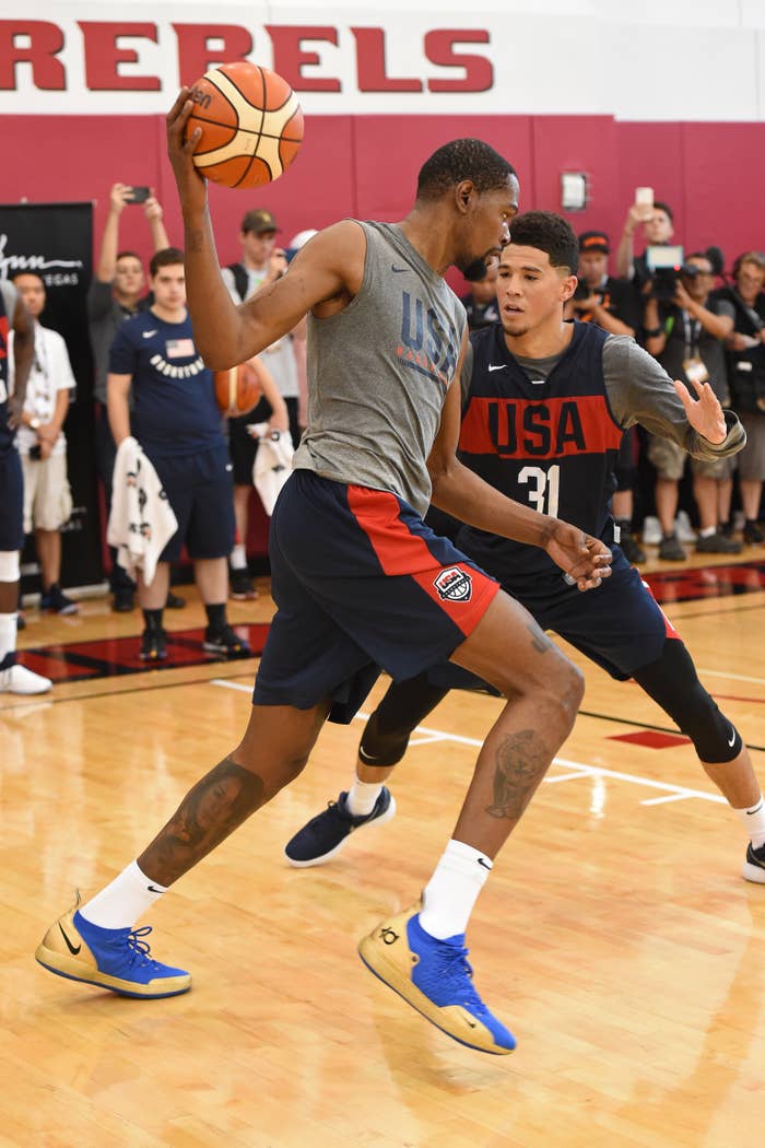 Two basketball players in action during a Team USA practice session