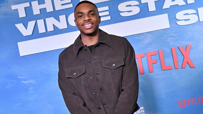 Vince Staples in a casual brown shirt poses at a Netflix event
