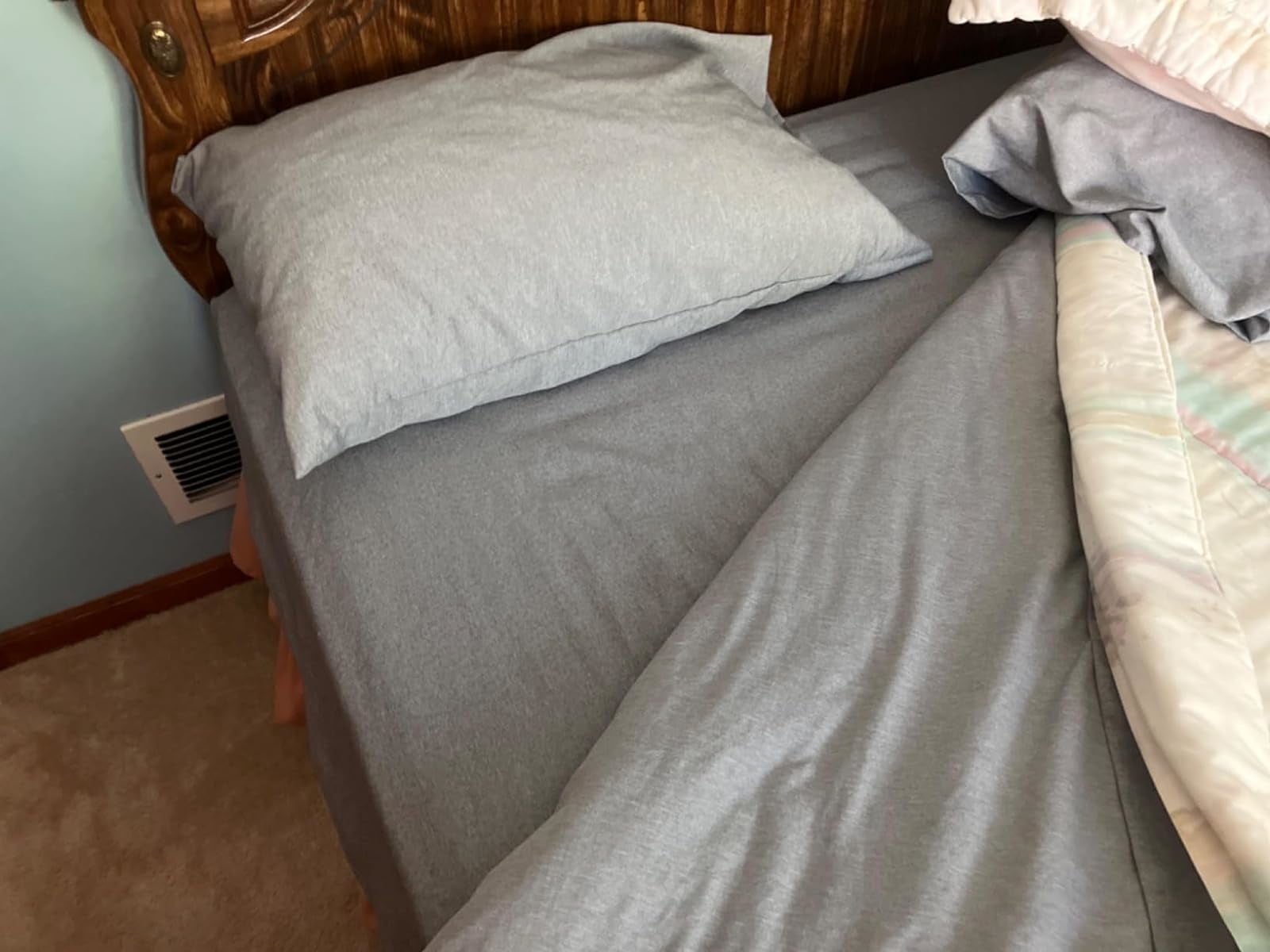 Unmade furniture  with a pillow and crumpled linens