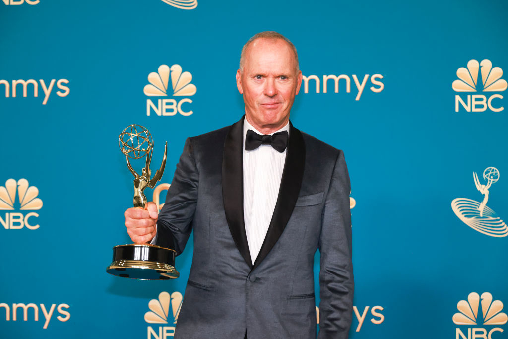Michael Keaton holding his Emmy