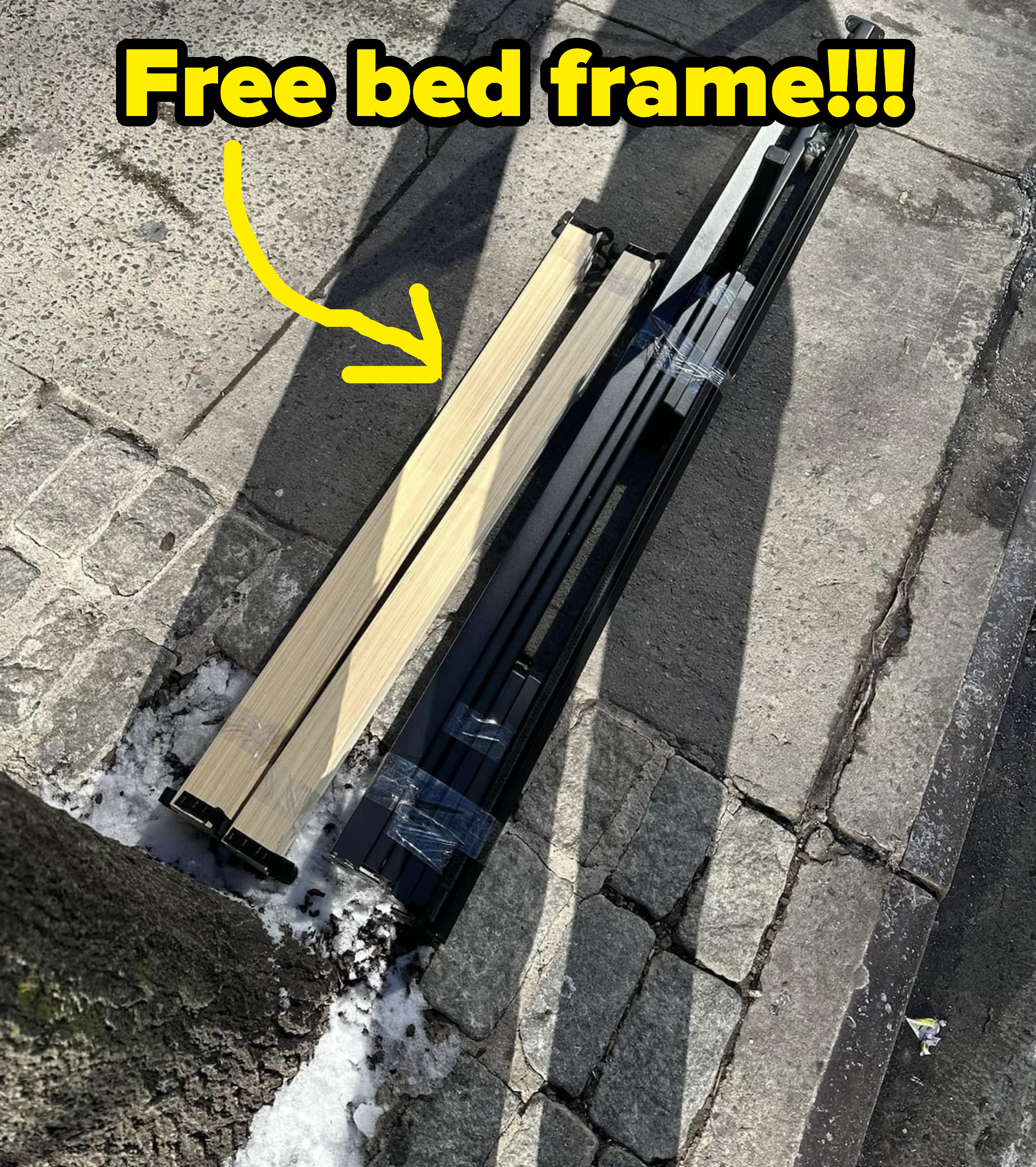 free bed frame on the sidewalk