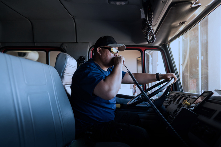truck driver talking into a radio
