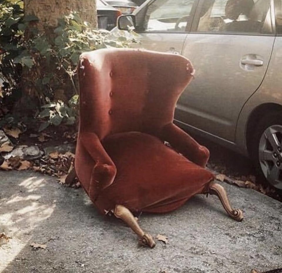 chair with broken legs that looks like it&#x27;s slumped over in defeat