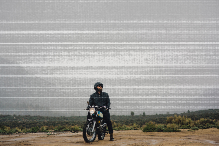 person on a motorcycle in the desert