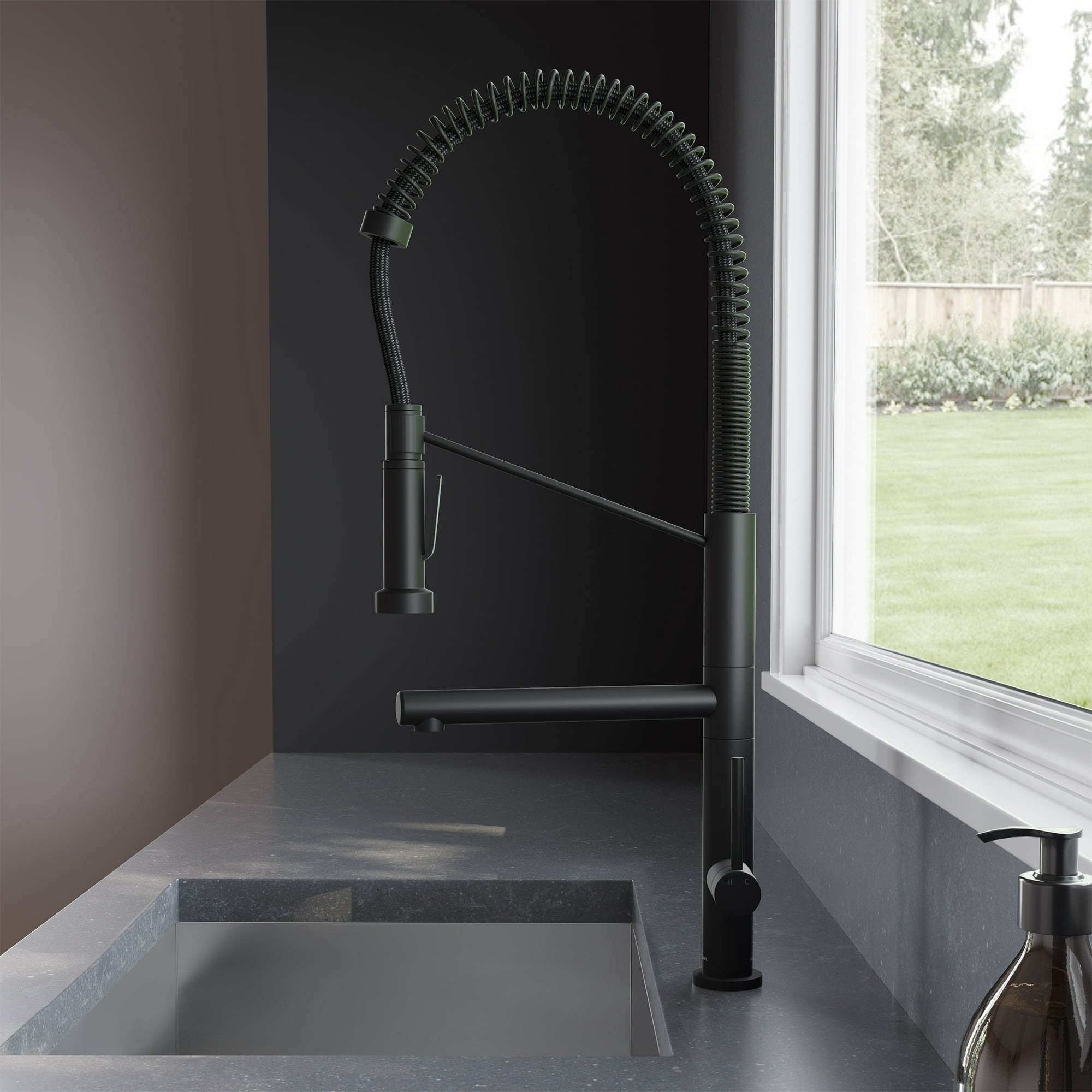 the black pull-down kitchen faucet