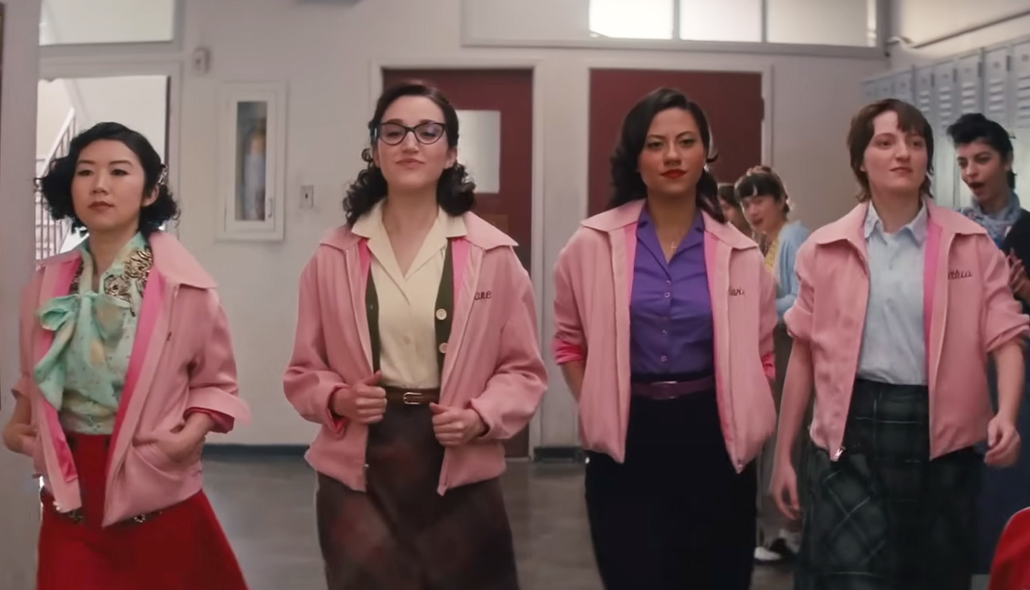 the pink ladies walking in the hallway